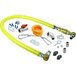 A yellow T&S Safe-T-Link gas hose with metal fittings and accessories.