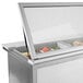 A Beverage-Air stainless steel refrigerated sandwich prep table with glass lids on a counter.