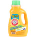 A bottle of Arm & Hammer 2X HE Perfume & Dye Free liquid laundry detergent with a label.