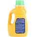 A yellow bottle of Arm & Hammer laundry detergent with a white lid.