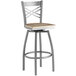 A Lancaster Table & Seating metal bar stool with a driftwood seat.