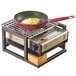 A pan with two eggs on a Cal-Mil Sierra bronze and rustic pine butane burner frame.