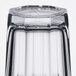 An Arcoroc clear beverage glass with a small square in the middle.
