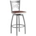 A Lancaster Table & Seating bar stool with a wooden seat and metal frame.