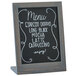 A Cal-Mil Ashwood chalkboard stand with a menu board with white writing on it.
