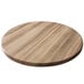 A round wooden table top with a natural finish on a white background.