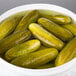 A bowl of Patriot Pickle Kosher Dill Whole Pickles in water.