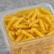 A case of Napoli Penne Rigate pasta on a table.