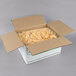 A cardboard box with two bags of 5 lb. IQF sliced peaches.