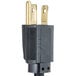 A close-up of a black rectangular plug with gold and white on it.