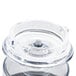 A clear plastic container with a round lid.