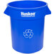 A blue plastic Continental round recycling bin with the word Huskees on it.