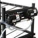A black metal rack with two clear tubes attached to a black Servend box with white labels.
