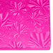 A pink fabric quarter sheet cake board with a patterned design.