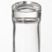 A close-up of American Metalcraft clear glass salt and pepper shakers.
