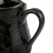 An American Metalcraft black porcelain bell creamer with a handle.