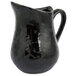 An American Metalcraft black porcelain bell creamer with a handle.