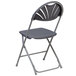 A black Flash Furniture folding chair with a fan back.