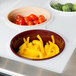 A white Cambro tray with bowls of vegetables on a table.