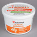 A white Kronos tub filled with classic hummus.