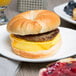 A plate with a Jones Dairy Farm All Natural Sausage Patty breakfast sandwich.