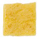 A yellow square scrambled egg patty with white specks.