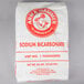 A white bag of Arm & Hammer Baking Soda with red and white text and logo.