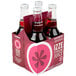 A case of six pink Izze 4-packs with bottles of sparkling blackberry juice.