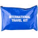 A blue Medique International Traveler first aid kit bag with white text.