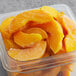 A plastic bag filled with IQF sliced peaches.