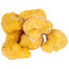A pile of McCain Anchor Battered Cauliflower on a white background.
