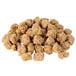 A pile of Hillshire Farm Sausage Topping Crumbles on a white background.