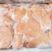 A package of Koch Foods boneless skinless chicken breasts in plastic wrap with a label.
