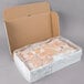 A white and blue box of Koch Foods split boneless skinless chicken breasts in plastic wrap.