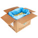 A white cardboard box with a blue plastic bag inside full of frozen green apple slices.