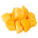A pile of IQF frozen mango chunks.