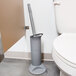 The Unger Ergo Toilet Bowl Swab sitting in a bathroom's toilet brush holder.