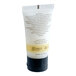 A small tube of Novo Essentials hotel and motel conditioner.