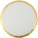 A white round cake drum with gold foil on the underside.