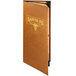 A brown leather Menu Solutions Bella Collection booklet on a table with gold lettering.