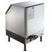 A stainless steel Manitowoc undercounter ice machine with a black lid.