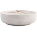 A white Oneida Marble porcelain bowl with brown veins.