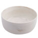 A white porcelain soup bowl with brown veins.