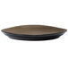A black porcelain Oneida Rustic plate with a brown rim.