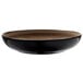 A white porcelain bowl with a black and brown rim.