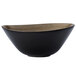 A white porcelain soup bowl with a black and brown rim.