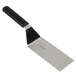 A black and silver Mercer Culinary Millennia square edge turner with a handle.
