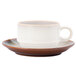 A white Oneida Rustic Sama porcelain espresso cup and saucer on a white surface.
