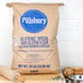 A bag of Pillsbury So Strong High Gluten Flour on a white counter.