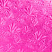 A pink surface with a pattern of leaves.